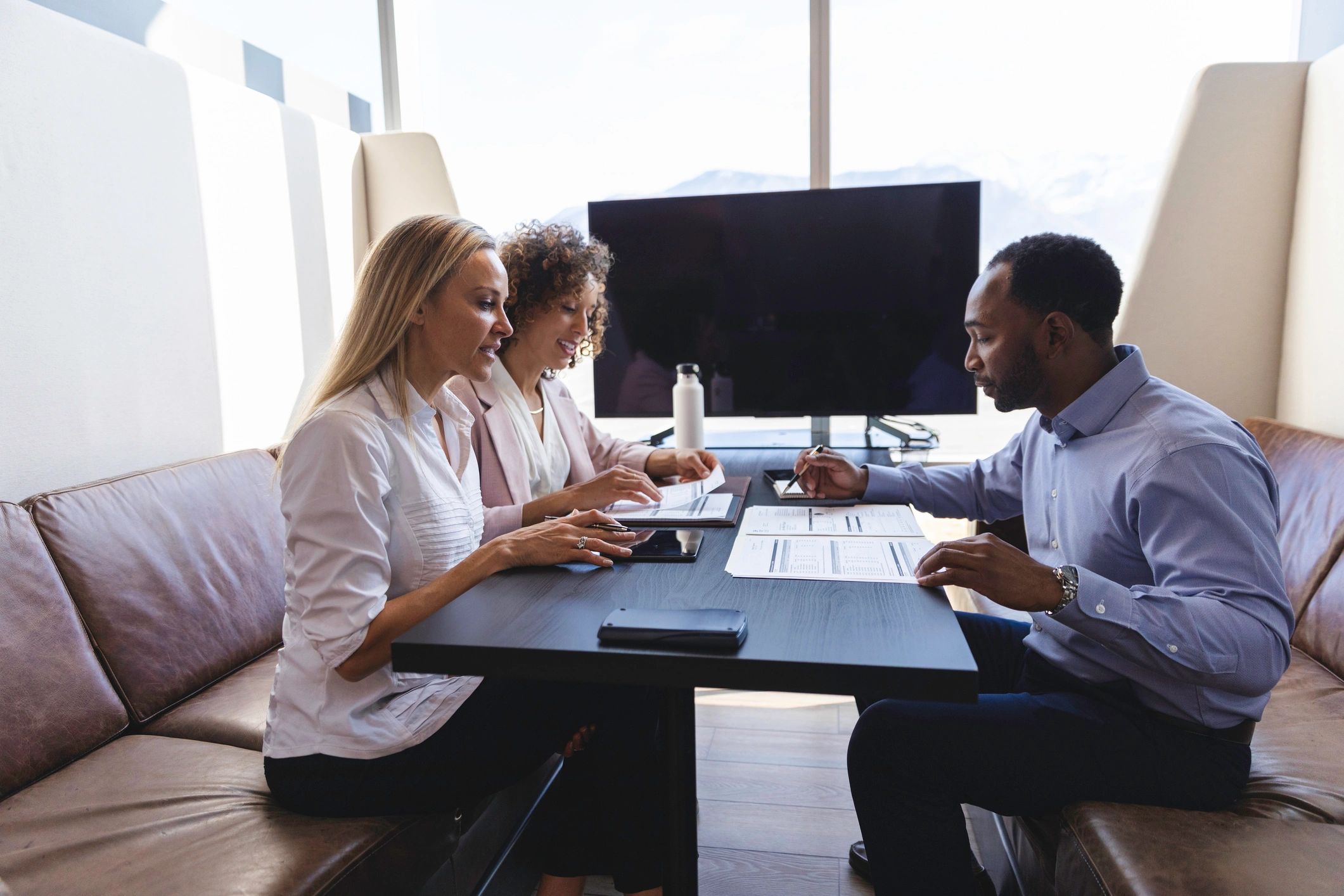 Advisors collaborating in a modern office