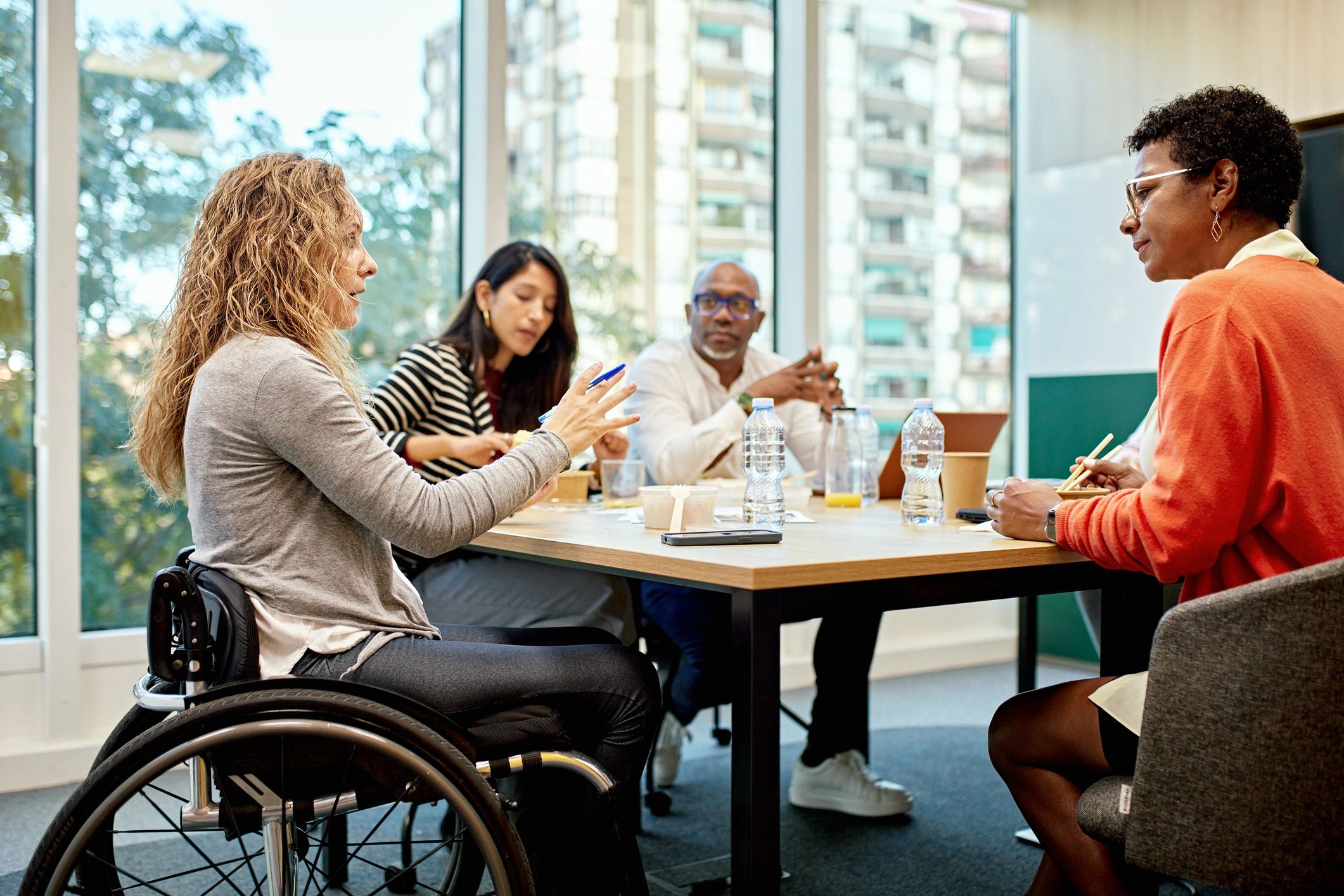 Diverse professionals discussing ideas around a conference table