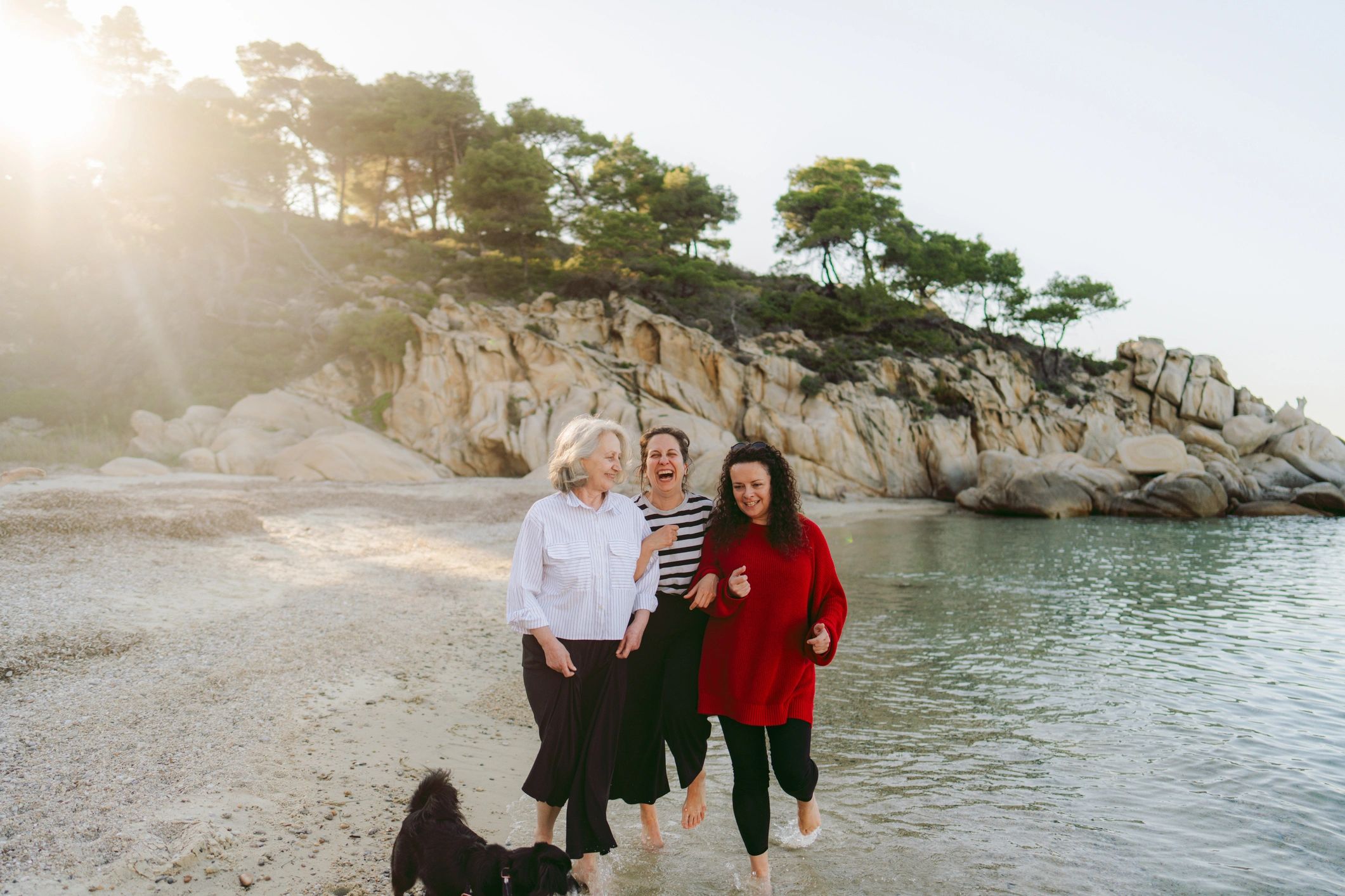 Family walking together along the beach