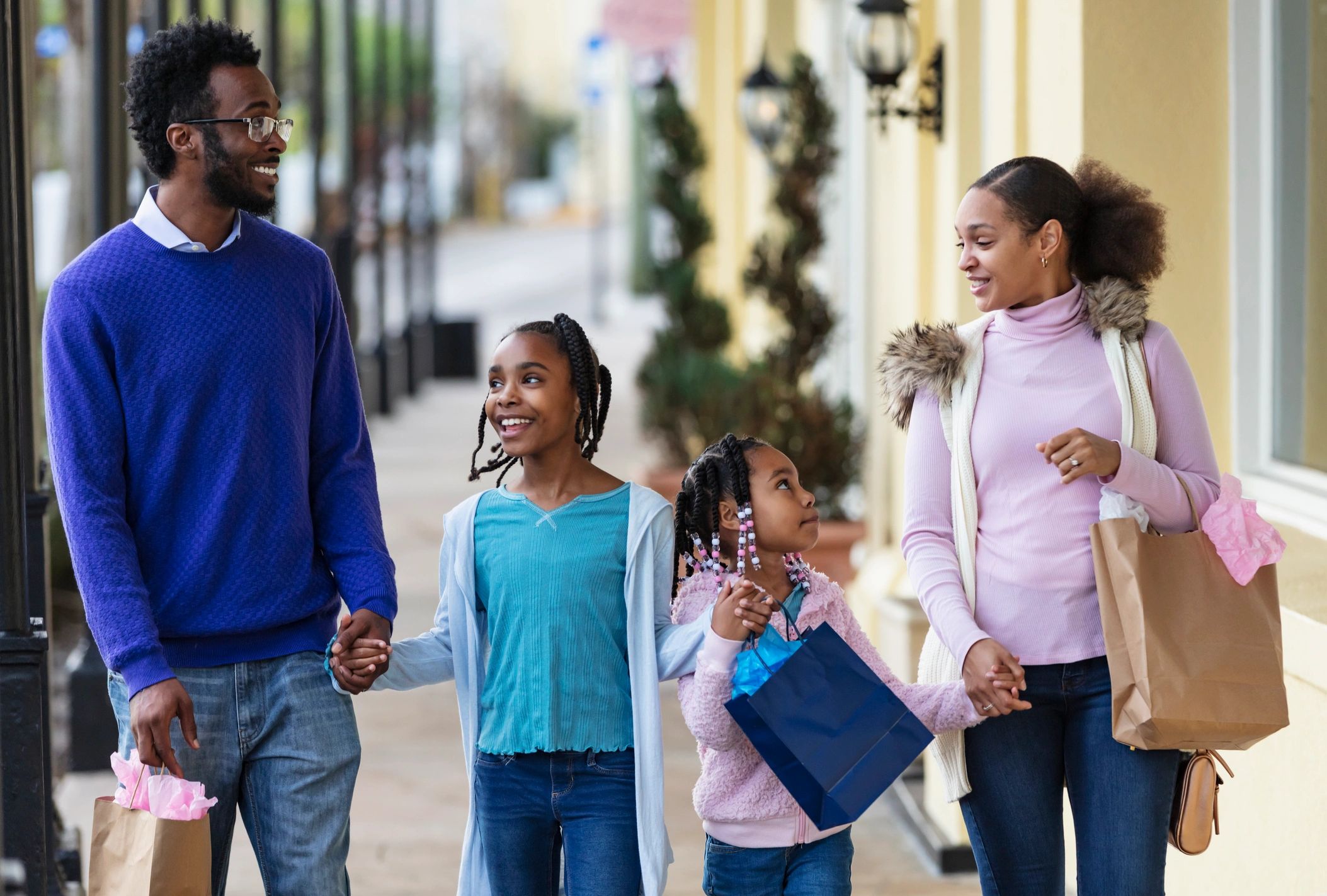 Family walking in a city shopping district