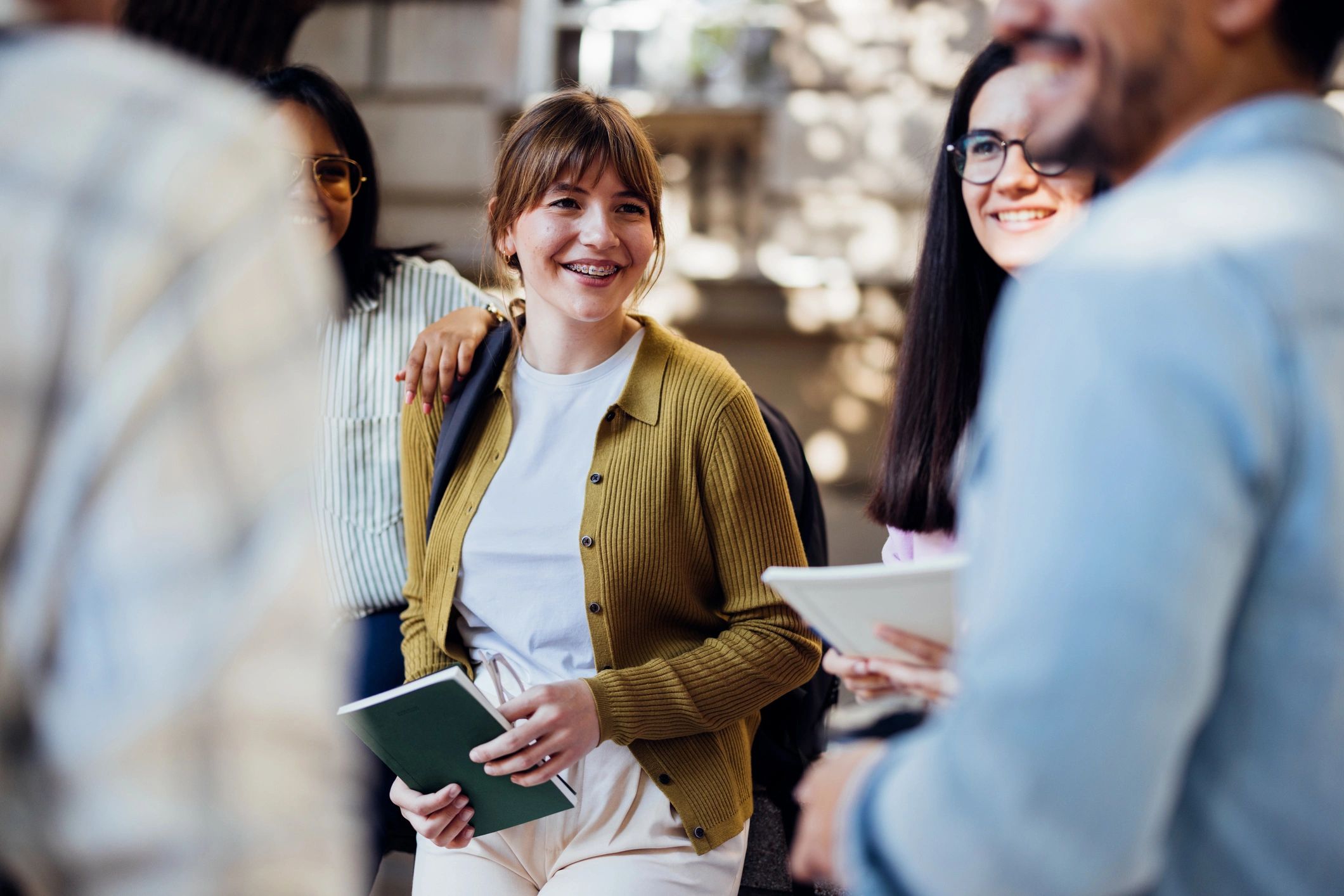 University students socializing outdoors on campus