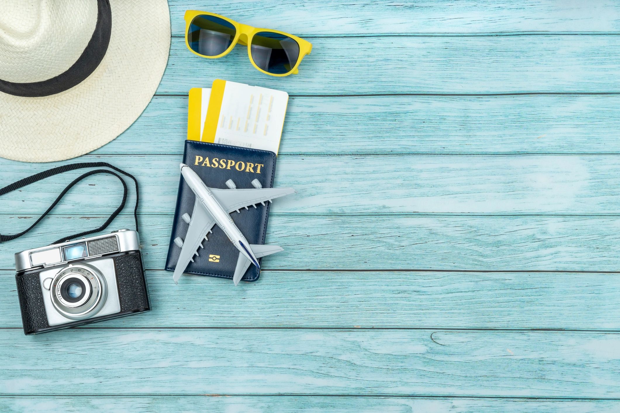 Passport and travel documents arranged on a desk
